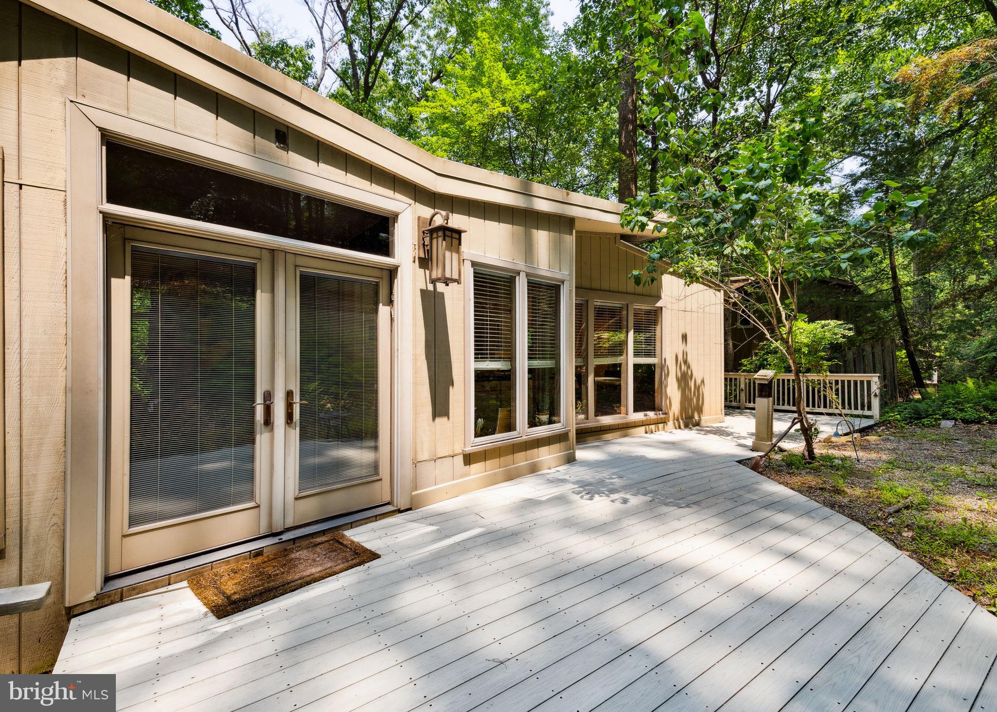 100 Pugh Road Wayne, PA 19087 - Photo 48 of 57 a view of house with backyard and glass door