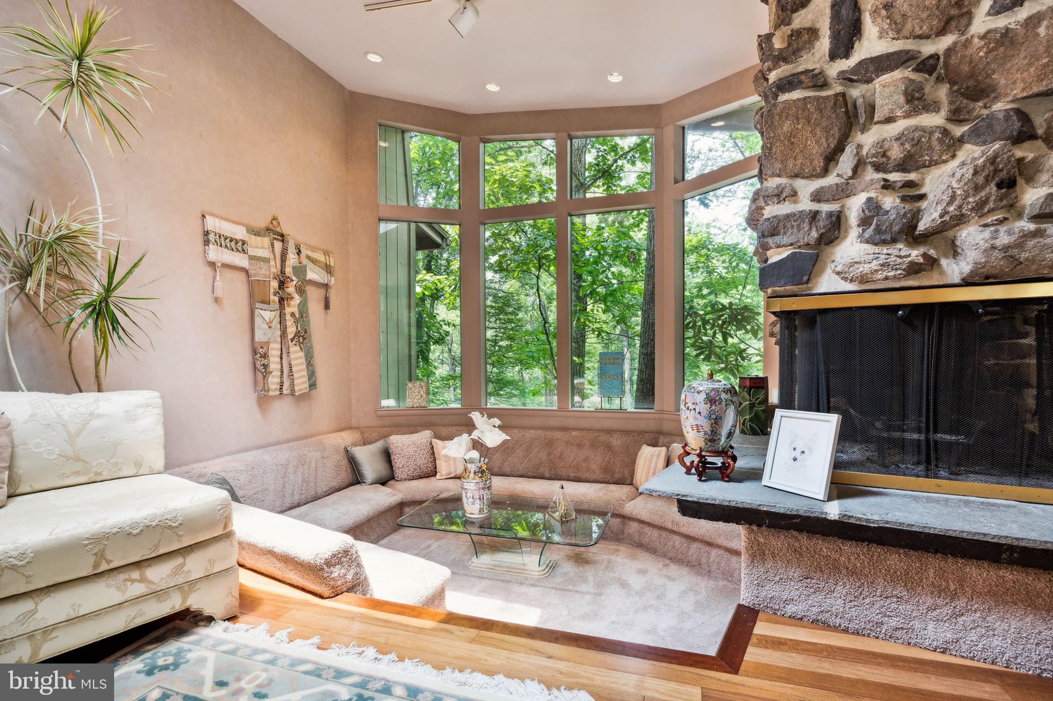 100 Pugh Road Wayne, PA 19087 - Photo 9 of 57 a living room with furniture and a large window