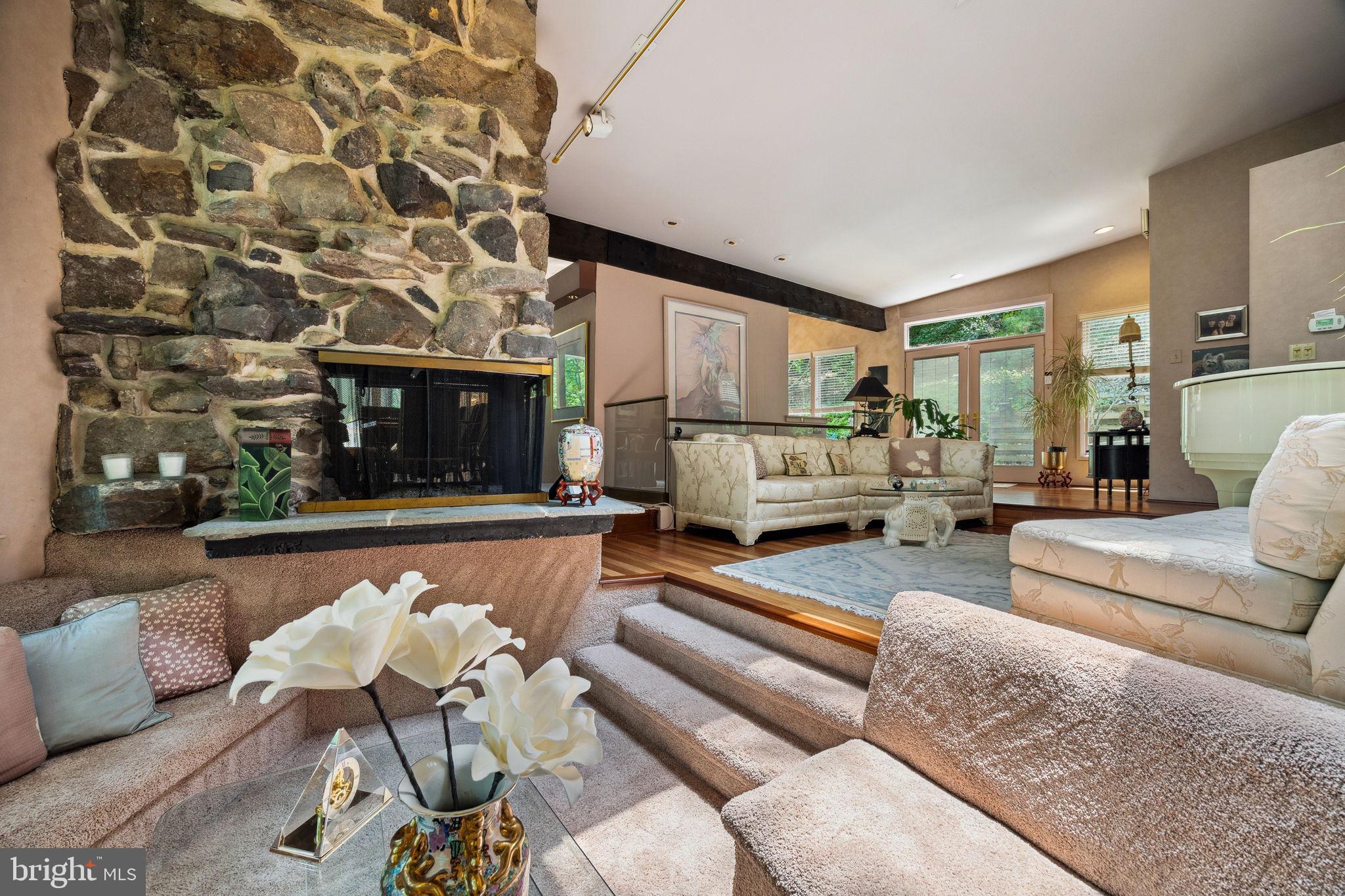 100 Pugh Road Wayne, PA 19087 - Photo 10 of 57 a living room with furniture and a fireplace