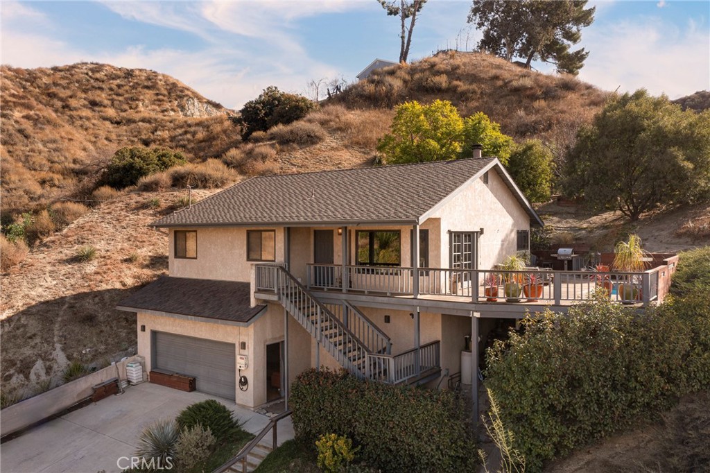 a aerial view of a house with a yard