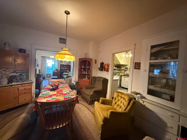 a living room with furniture fireplace and flat screen tv
