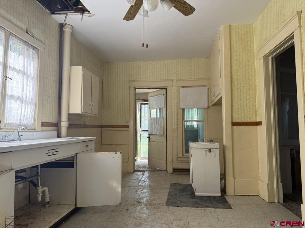 613 3rd Street Paonia, CO 81428 - Photo 12 of 44 a large room with a sink and a mirror