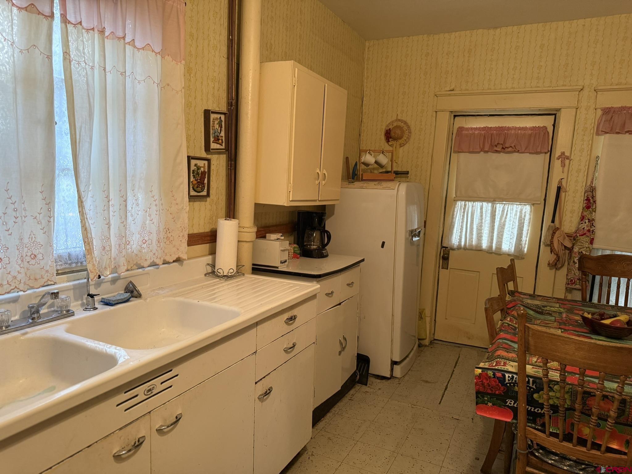613 3rd Street Paonia, CO 81428 - Photo 16 of 33 a bathroom with a sink double vanity and a mirror