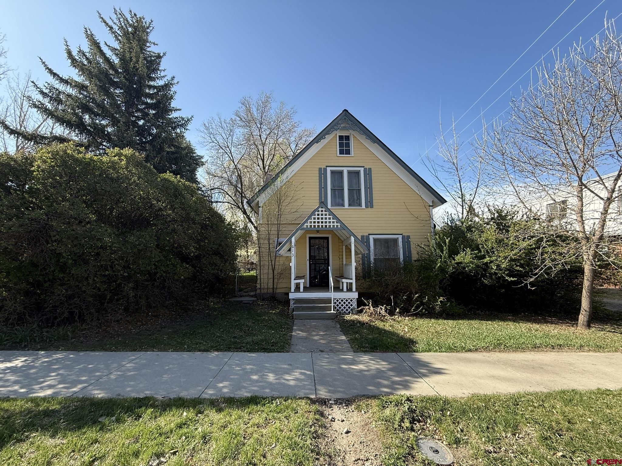 613 3rd Street Paonia, CO 81428 - Photo 2 of 33 a front view of a house with a yard