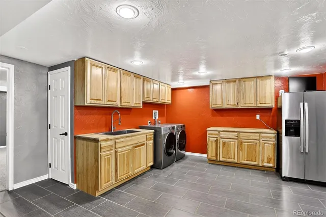 a kitchen with stainless steel appliances granite countertop a stove and a refrigerator