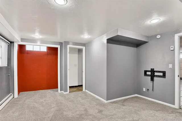 an empty room with closet and a bathroom