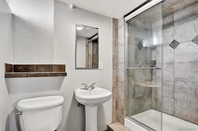 a bathroom with a sink and toilet