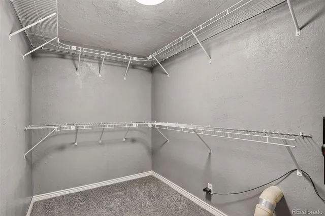 a view of a room with racks on the wall