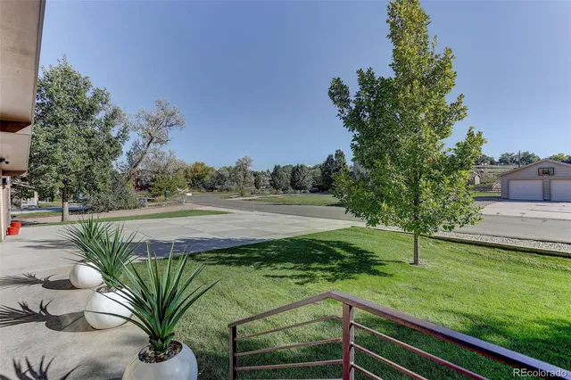 a view of a yard with an outdoor space