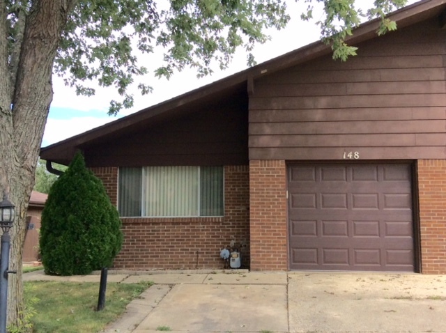 148 Innsbrook Drive Streamwood, IL 60107 - Photo 1 of 19 a front view of a house