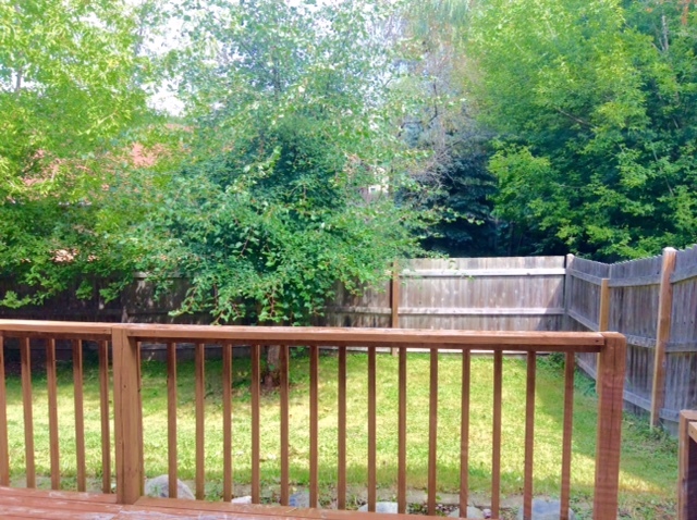 148 Innsbrook Drive Streamwood, IL 60107 - Photo 16 of 19 a view of a wooden deck and backyard