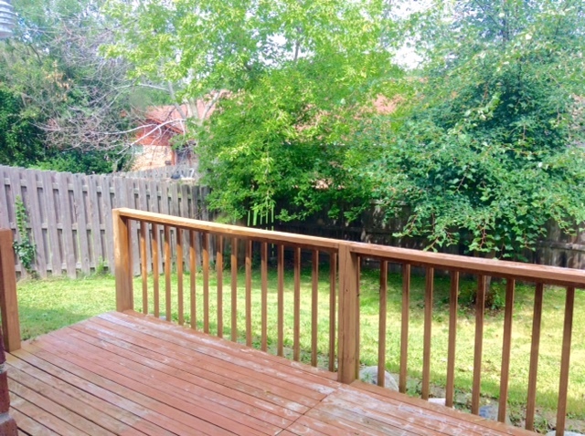 148 Innsbrook Drive Streamwood, IL 60107 - Photo 17 of 19 a view of a wooden deck with a yard