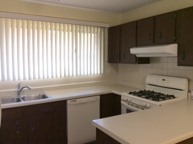 148 Innsbrook Drive Streamwood, IL 60107 - Photo 5 of 19 a kitchen with a cabinets and a stove top oven