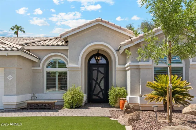 a front view of a house with garden