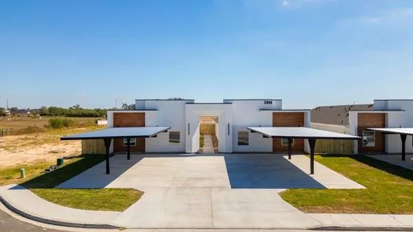 an aerial view of a house with a swimming pool