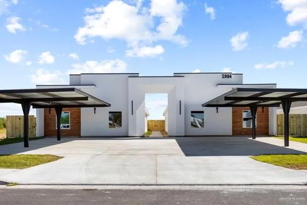 a view of house with basketball court