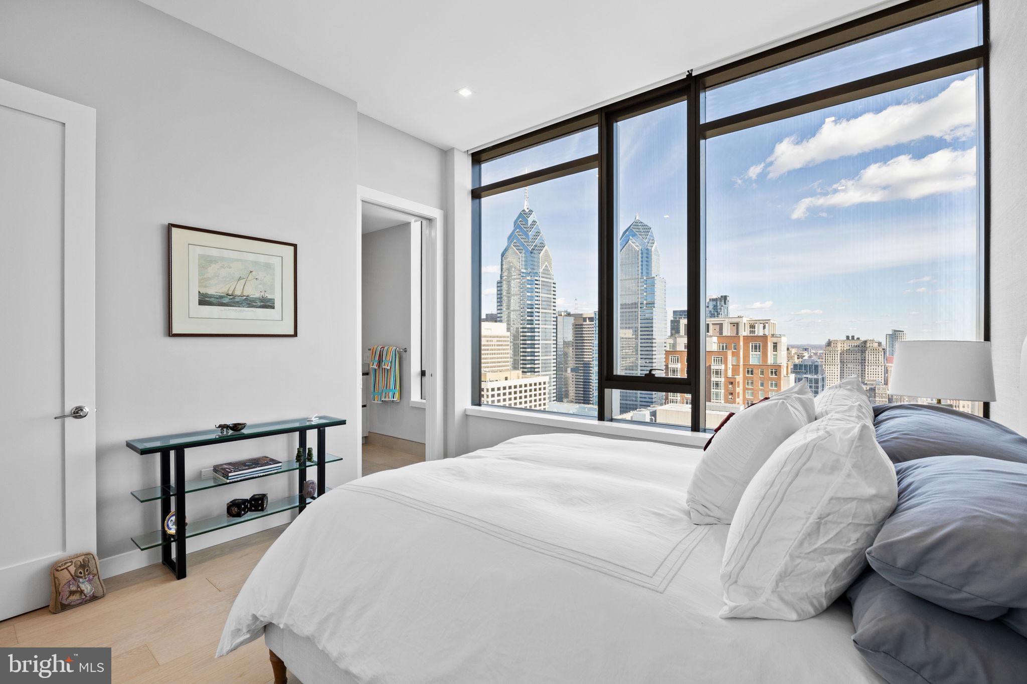 1911 Walnut Street, Unit 3301 Philadelphia, PA 19103 - Photo 26 of 50 a bedroom with a large bed and a large window