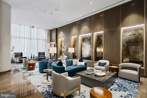 a living room with furniture rug and window