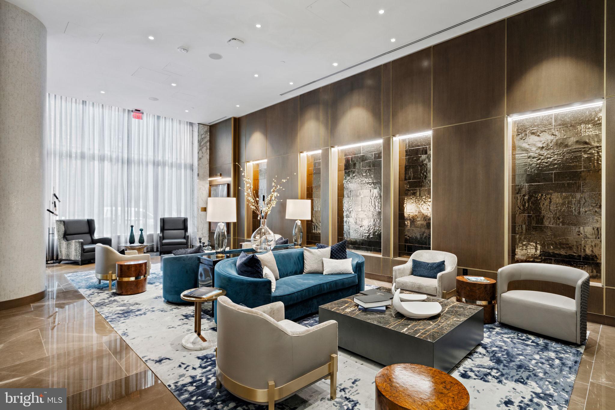 1911 Walnut Street, Unit 3301 Philadelphia, PA 19103 - Photo 38 of 50 a living room with furniture and large windows