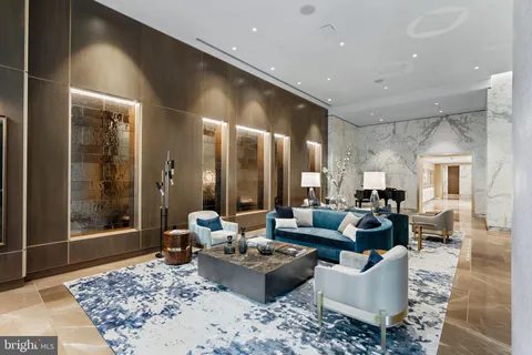 a balcony with furniture and a potted plant