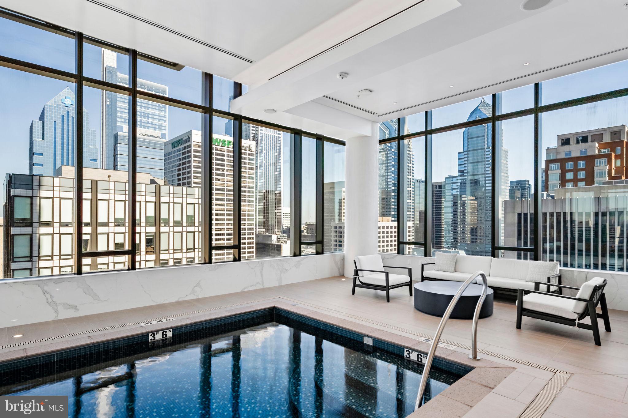 1911 Walnut Street, Unit 3301 Philadelphia, PA 19103 - Photo 47 of 50 a living room with furniture and a large window