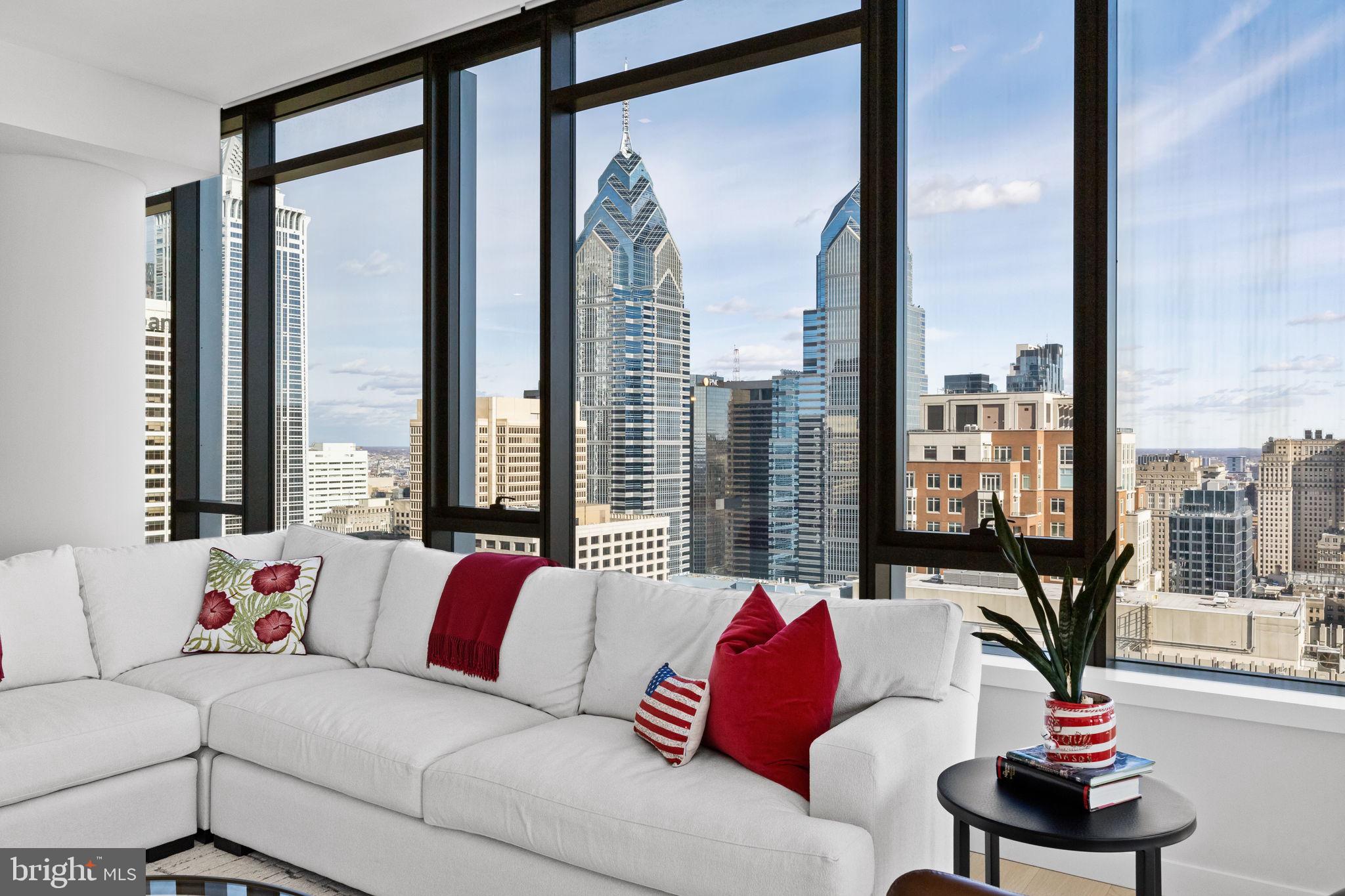 1911 Walnut Street, Unit 3301 Philadelphia, PA 19103 - Photo 9 of 50 a living room with furniture and a large window