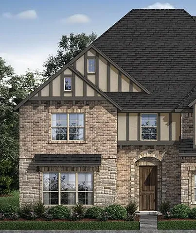 a front view of residential houses with yard