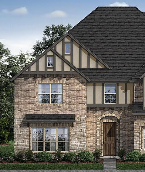 a front view of residential houses with yard