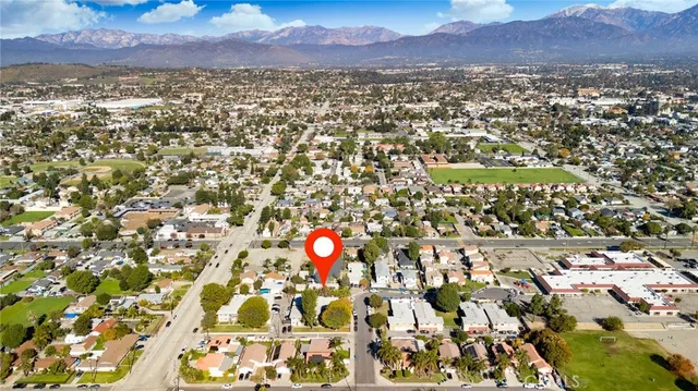 an aerial view of a golf course with parking space