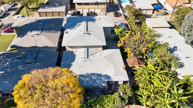 an aerial view of a house with a yard and garden