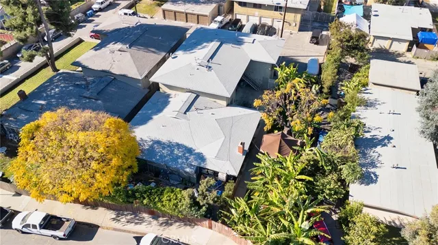 an aerial view of a house with a yard