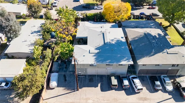 an aerial view of a house with garden space and sitting space