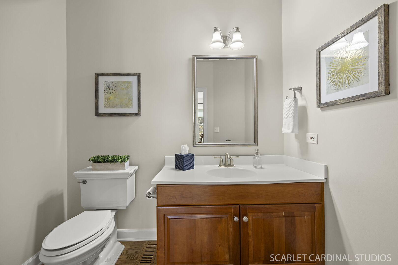 1907 Kingsbrook Court Wheaton, IL 60187 - Photo 11 of 29 a bathroom with a toilet a sink and mirror