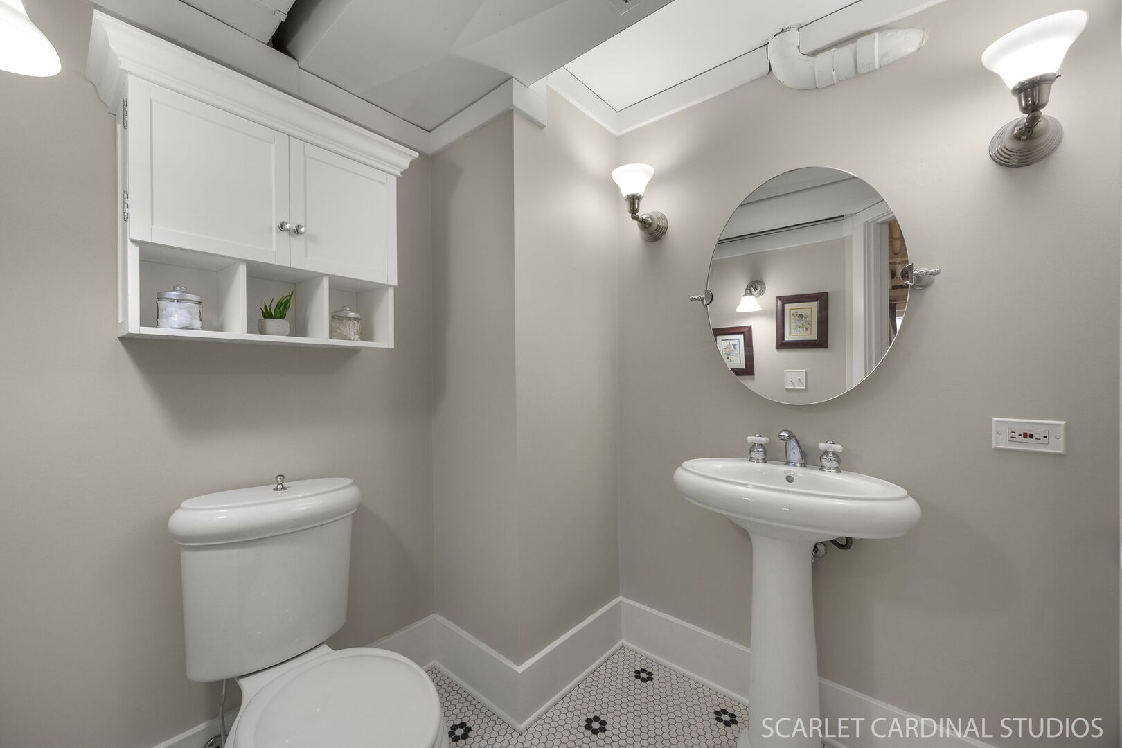 1907 Kingsbrook Court Wheaton, IL 60187 - Photo 23 of 29 a bathroom with a toilet sink and mirror