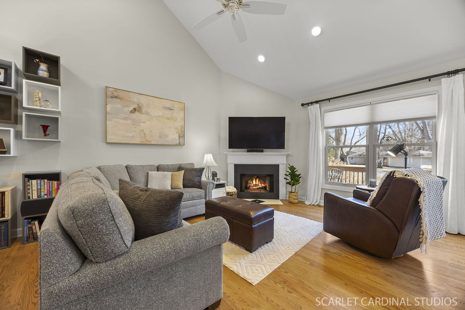 1907 Kingsbrook Court Wheaton, IL 60187 - Photo 4 of 29 a living room with furniture fireplace and a flat screen tv