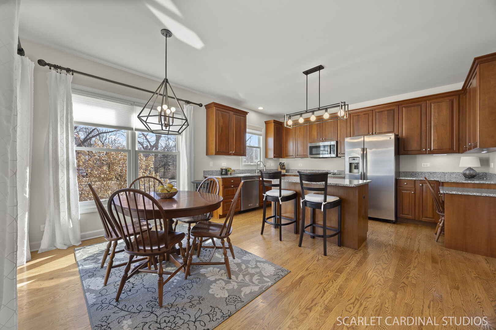1907 Kingsbrook Court Wheaton, IL 60187 - Photo 6 of 29 a view of a dining room with furniture window and wooden floor