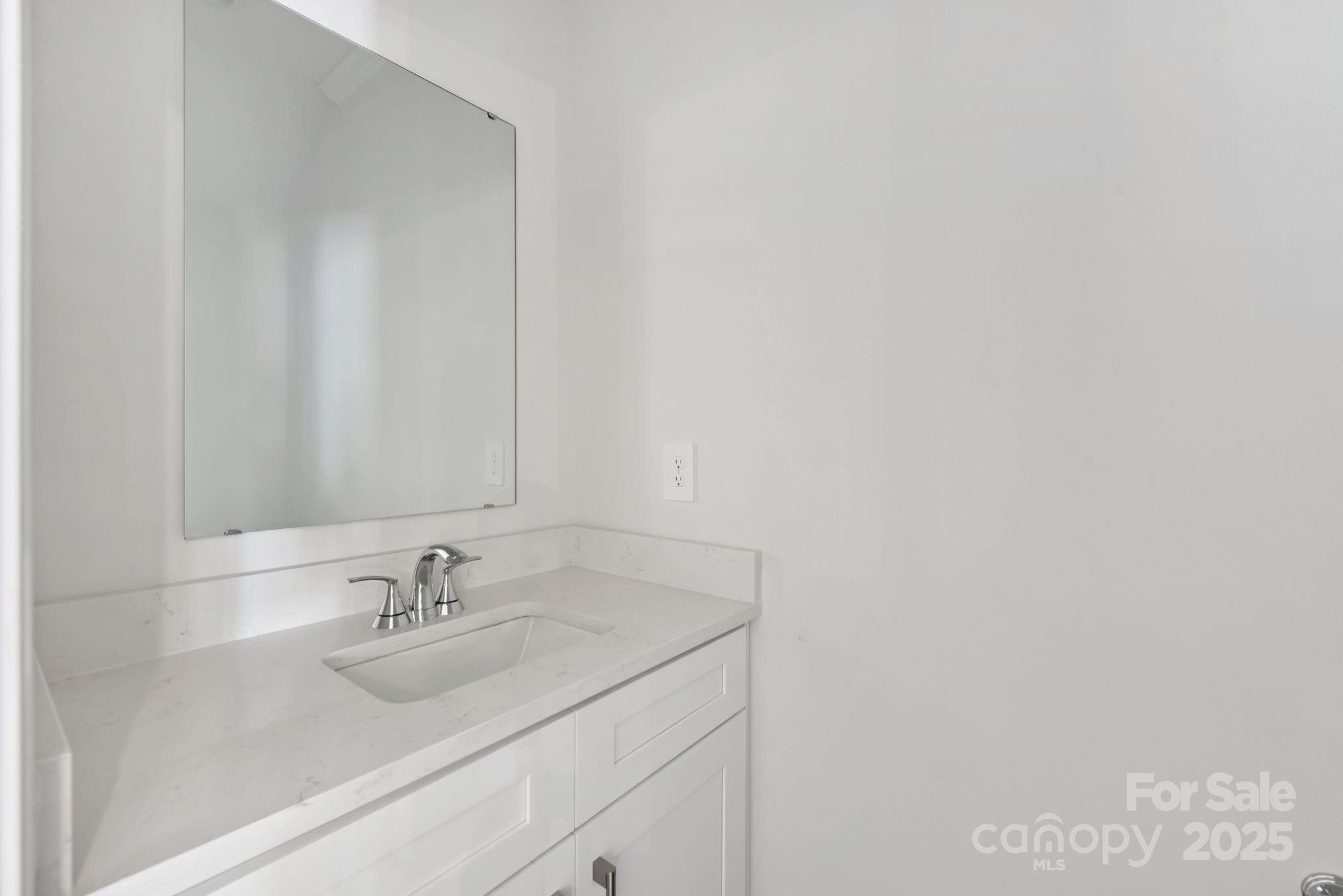282 Tiger Lily Drive Fort Mill, SC 29708 - Photo 5 of 18 a bathroom with a sink and a mirror