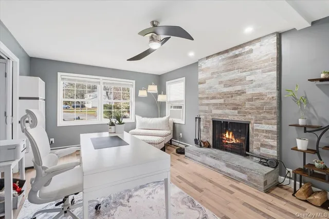 a living room with furniture and a fireplace