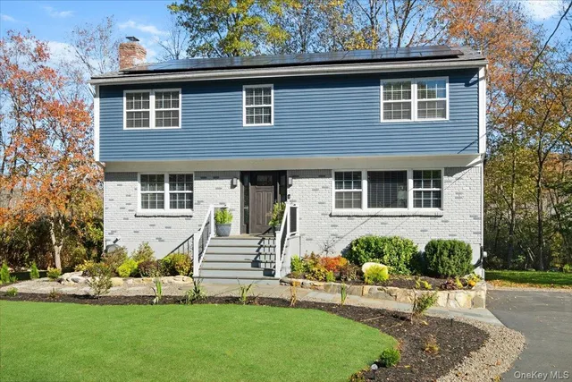 front view of a house with a yard