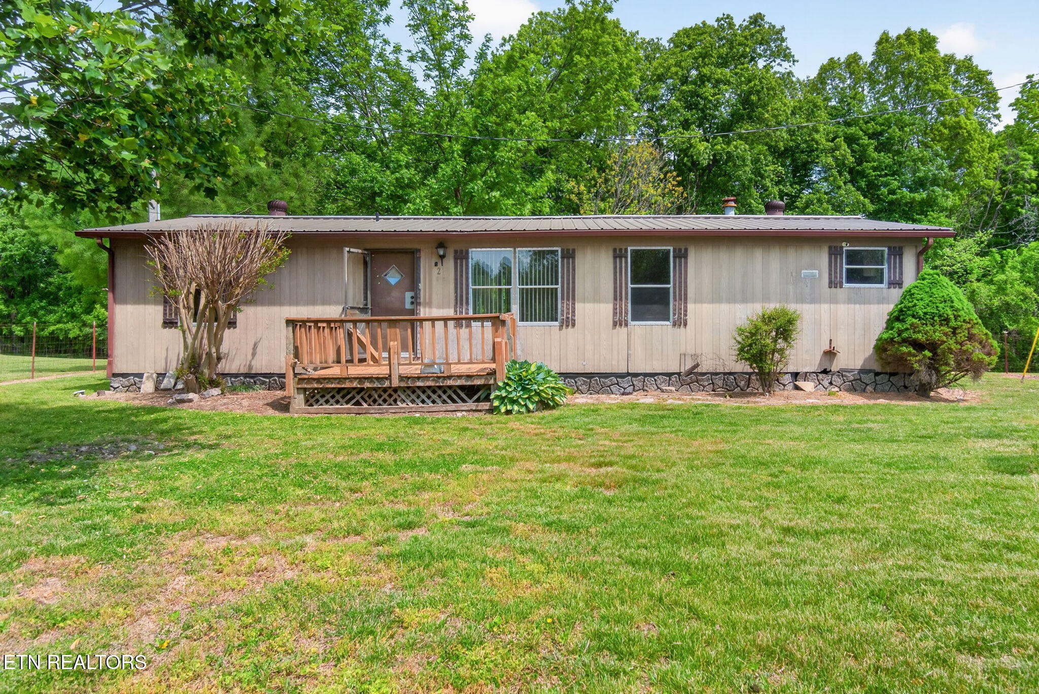 259 Freewill Ridge Road Gainesboro, TN 38562 - Photo 22 of 36 a view of a house with a yard and sitting area
