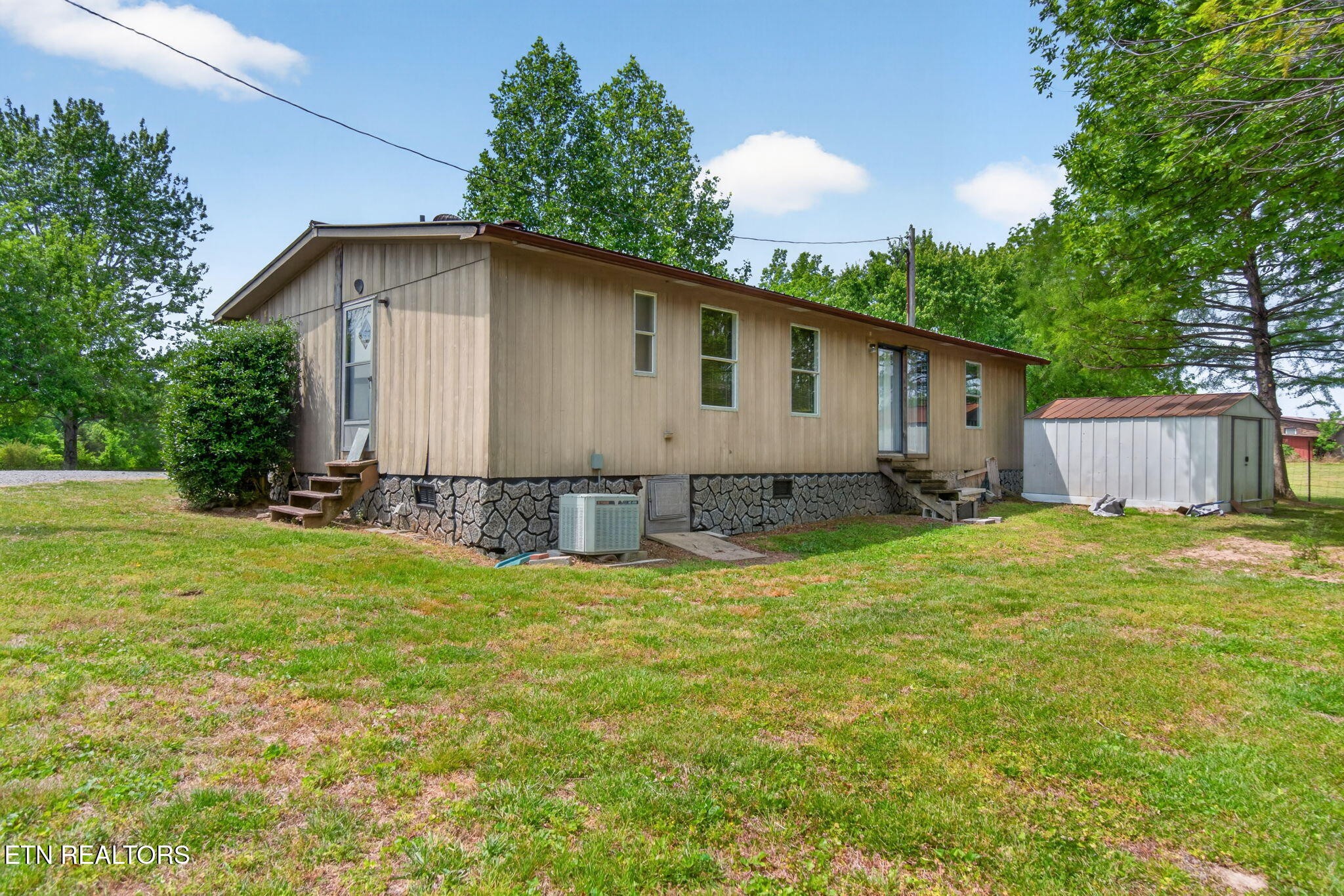 259 Freewill Ridge Road Gainesboro, TN 38562 - Photo 24 of 36 a view of a house with backyard and garden