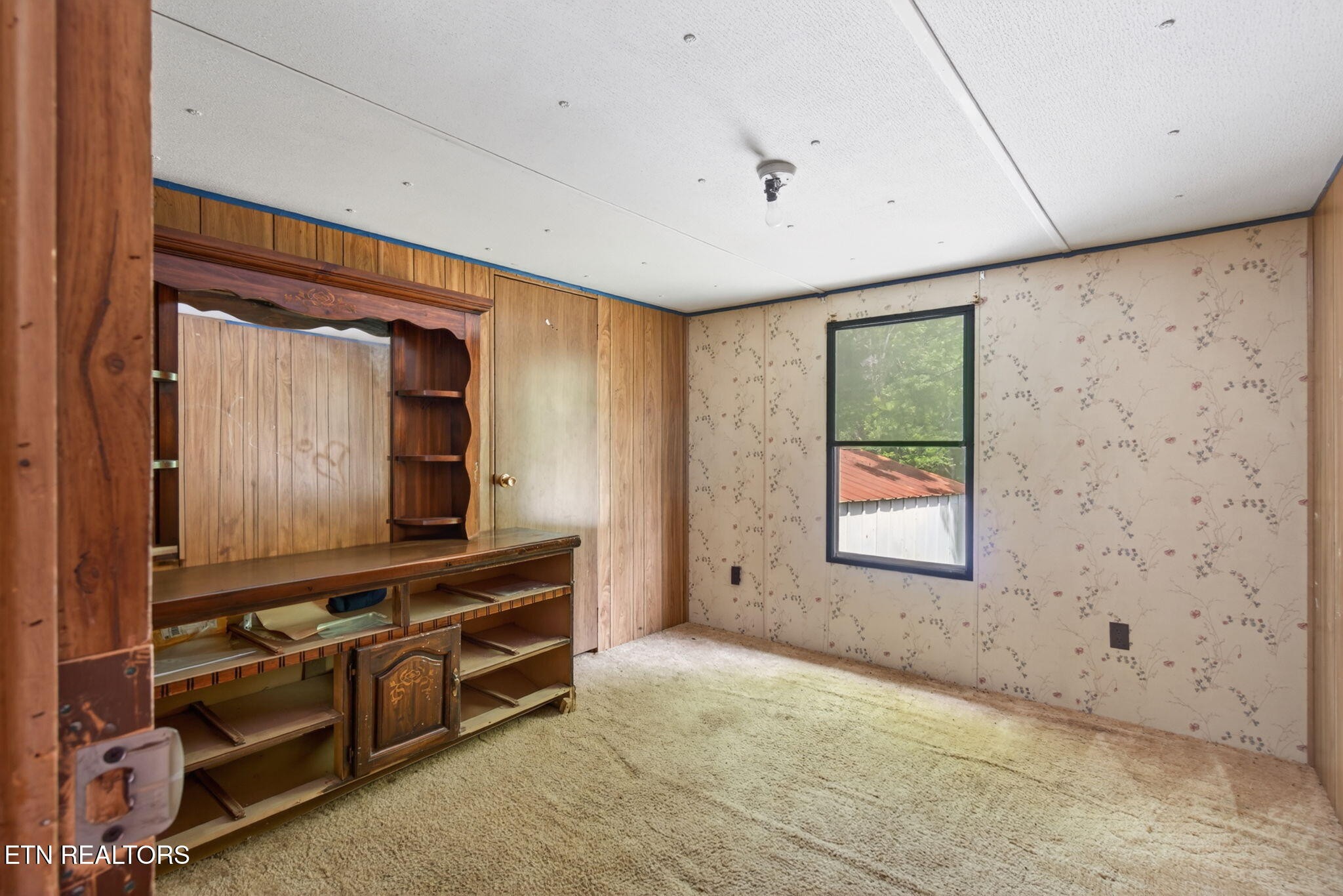 259 Freewill Ridge Road Gainesboro, TN 38562 - Photo 34 of 36 a room with furniture and flat screen tv