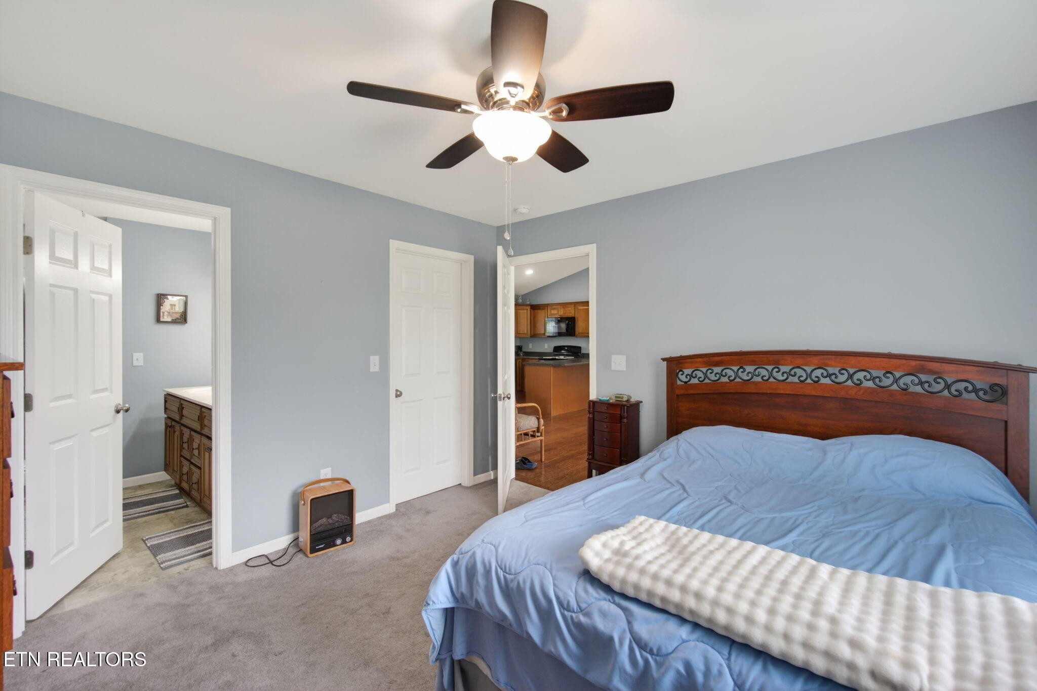 259 Freewill Ridge Road Gainesboro, TN 38562 - Photo 7 of 36 a bedroom with a bed and a chandelier