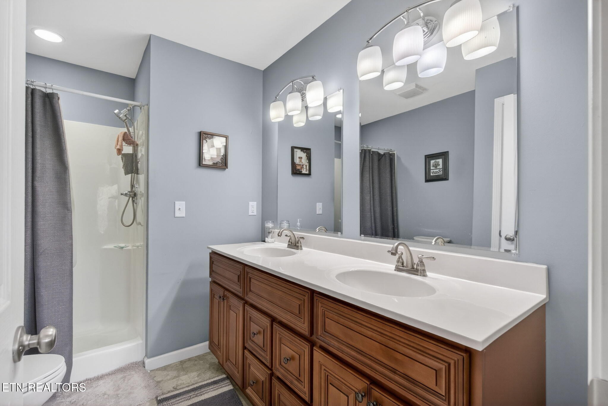 259 Freewill Ridge Road Gainesboro, TN 38562 - Photo 8 of 36 a bathroom with a sink double vanity and a mirror
