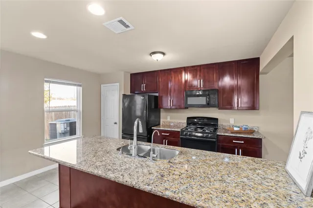 a bathroom with a sink vanity and a mirror