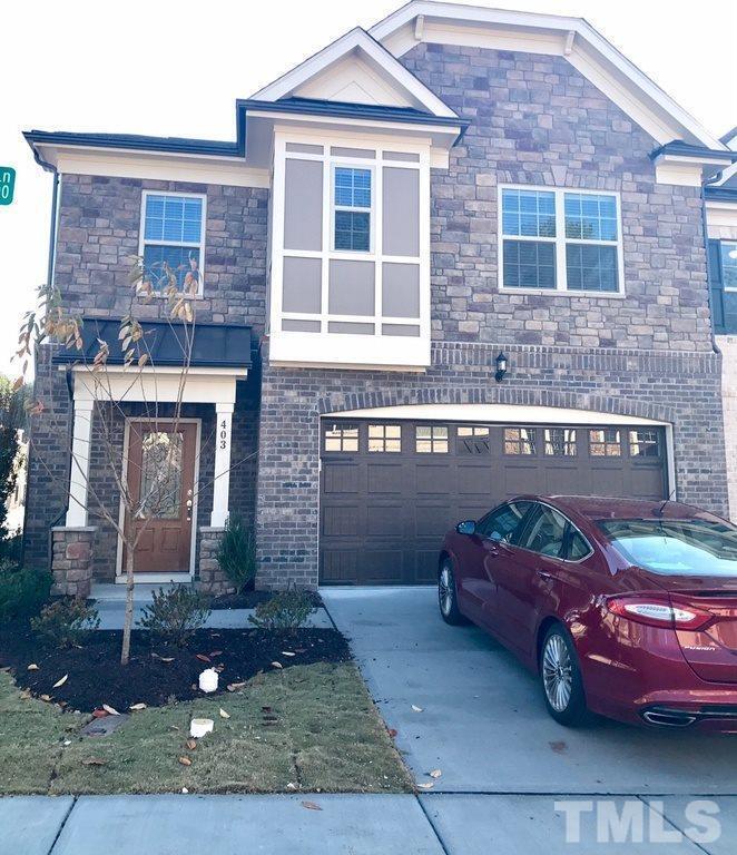 403 Bent Tree Lane Cary, NC 27519 - Photo 1 of 13 a front view of a house with parking space