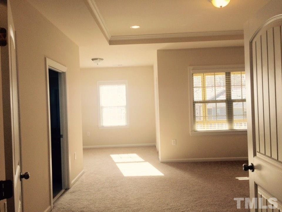 403 Bent Tree Lane Cary, NC 27519 - Photo 12 of 13 a view of an empty room with a window
