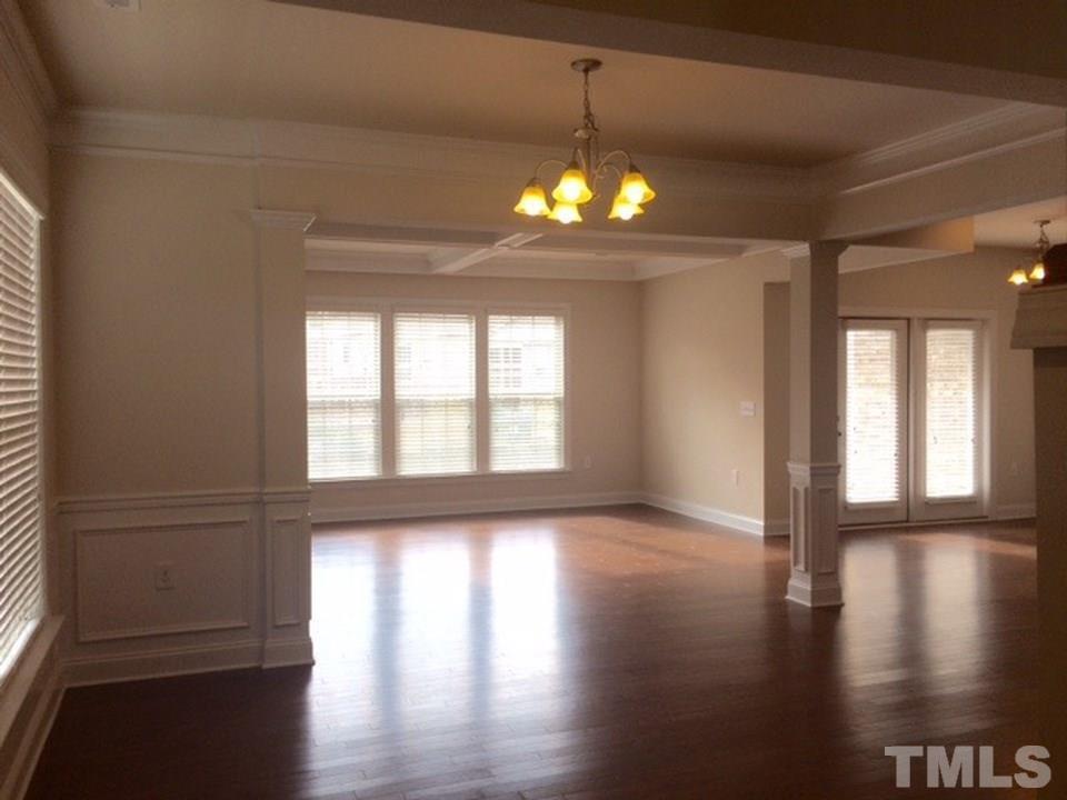 403 Bent Tree Lane Cary, NC 27519 - Photo 5 of 13 a view of a livingroom with hardwood floor and a ceiling fan