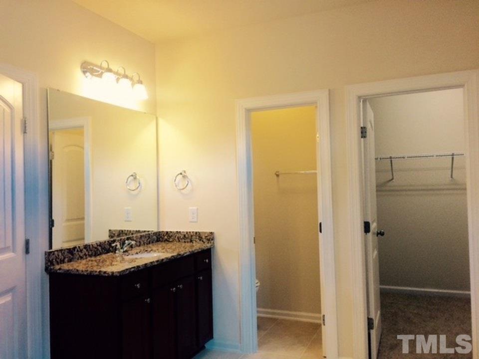 403 Bent Tree Lane Cary, NC 27519 - Photo 7 of 13 a bathroom with a sink and a mirror
