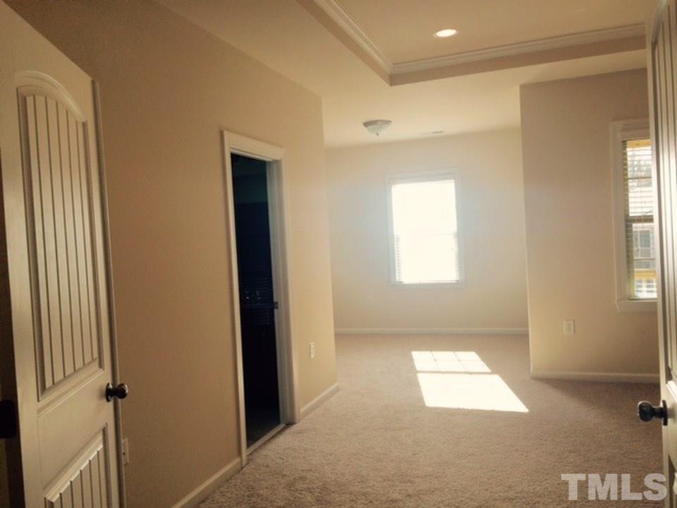 403 Bent Tree Lane Cary, NC 27519 - Photo 10 of 13 an empty room with windows